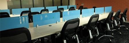 Modern office workspace with ergonomic chairs and workstations at Profuse Properties.